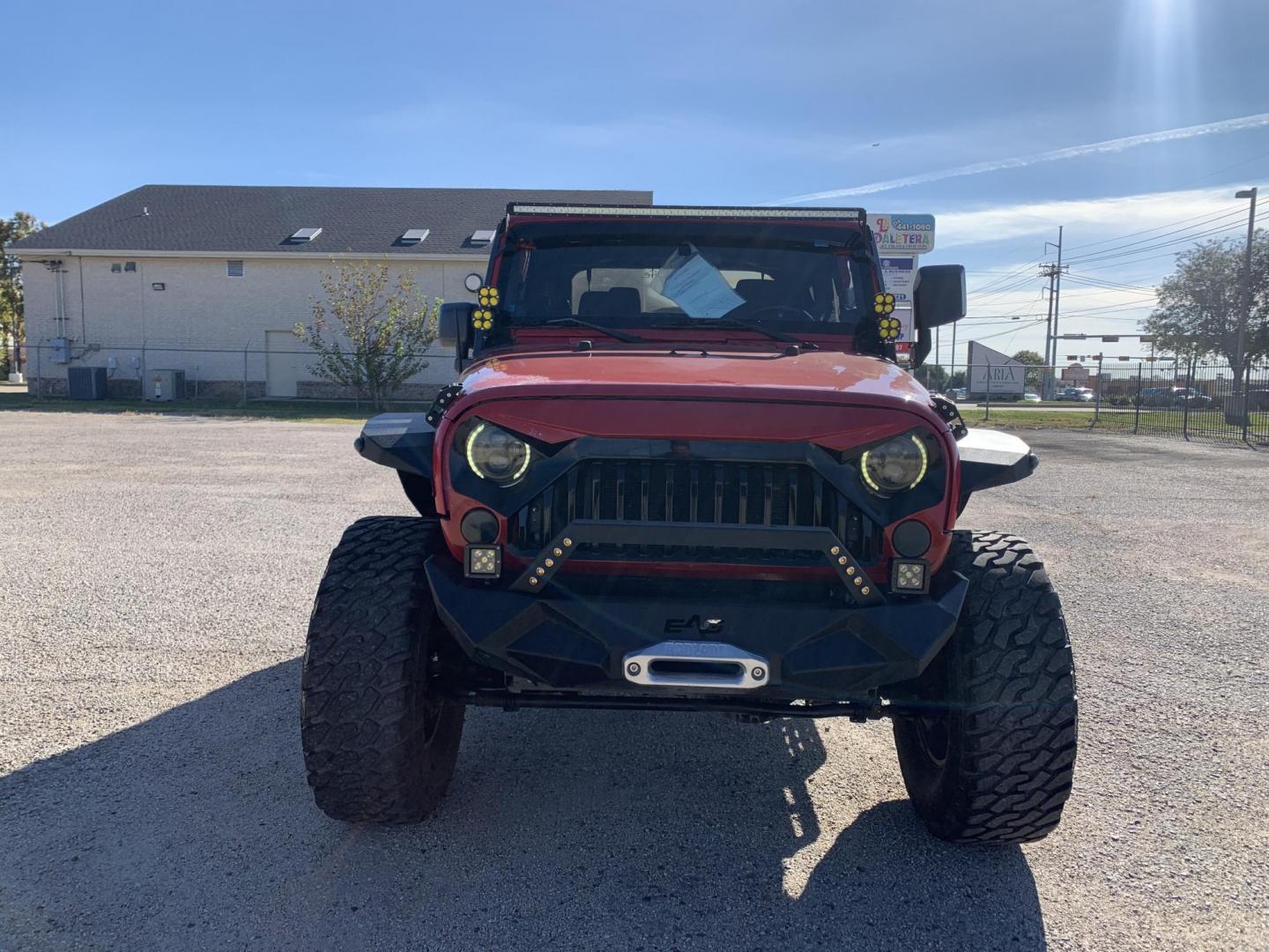 2011 Red /Black Jeep Wrangler Sport 4WD (1J4AA2D12BL) with an 3.8L V6 OHV 12V engine, Auto transmission, located at 1830 North Belt Line Road, Irving, TX, 75061, (469) 524-0199, 32.834373, -96.993584 - Photo#1