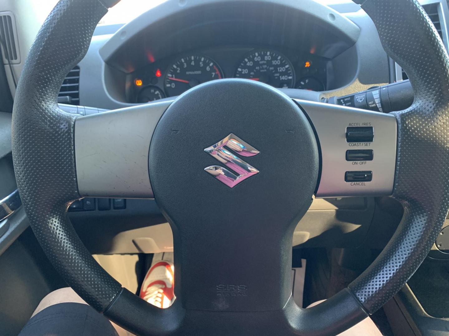 2012 White Suzuki Equator Sport Crew Cab 2WD (5Z61D0ER4CC) with an 4.0L V6 DOHC 24V engine, Automatic transmission, located at 1830 North Belt Line Road, Irving, TX, 75061, (469) 524-0199, 32.834373, -96.993584 - Photo#13