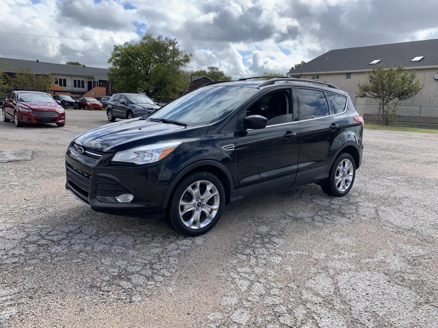 2013 Black /gray Ford Escape SE AWD (1FMCU9GX2DU) with an 1.6L L4 DOHC 16V engine, Automatic transmission, located at 1830 North Belt Line Road, Irving, TX, 75061, (469) 524-0199, 32.834373, -96.993584 - Photo#2