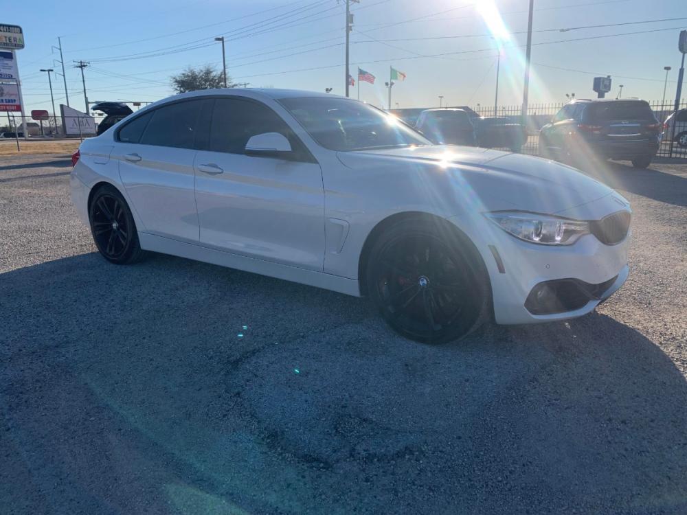 2016 White /Red BMW 4-Series Gran Coupe 428i SULEV (WBA4A9C59GG) with an 2.0L L4 DOHC 16V engine, 8A transmission, located at 1830 North Belt Line Road, Irving, TX, 75061, (469) 524-0199, 32.834373, -96.993584 - Photo #3