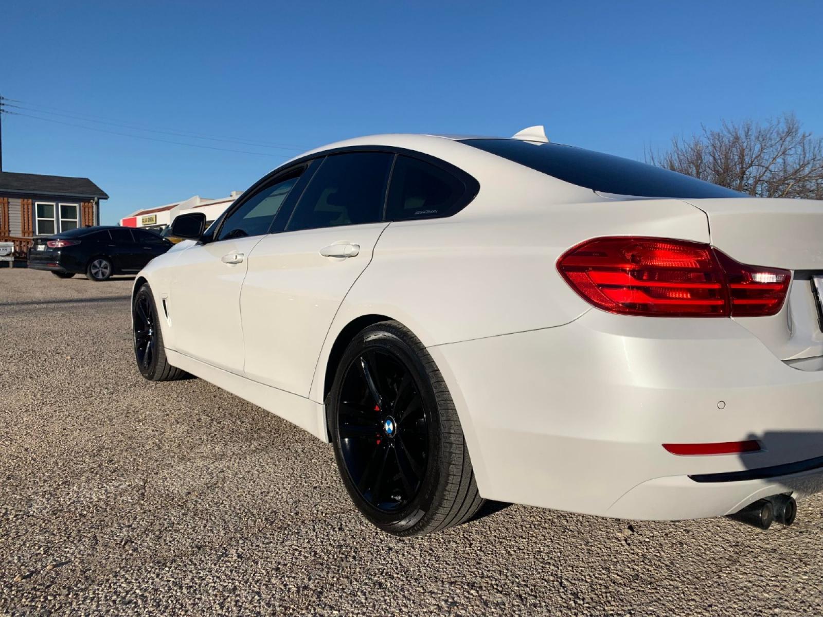 2016 White /Red BMW 4-Series Gran Coupe 428i SULEV (WBA4A9C59GG) with an 2.0L L4 DOHC 16V engine, 8A transmission, located at 1830 North Belt Line Road, Irving, TX, 75061, (469) 524-0199, 32.834373, -96.993584 - Photo #4