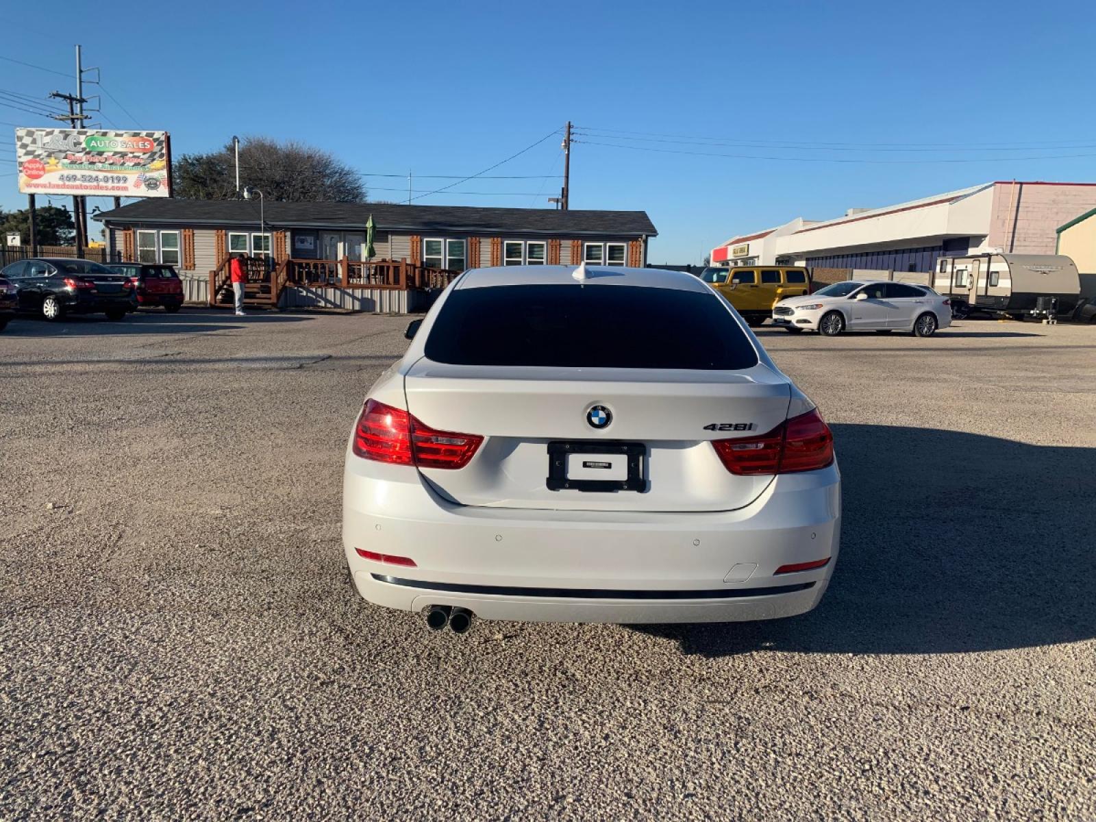 2016 White /Red BMW 4-Series Gran Coupe 428i SULEV (WBA4A9C59GG) with an 2.0L L4 DOHC 16V engine, 8A transmission, located at 1830 North Belt Line Road, Irving, TX, 75061, (469) 524-0199, 32.834373, -96.993584 - Owners personal vehicle. Runs and drives perfect! Rebuilt Title CASH ONLY - Photo #6