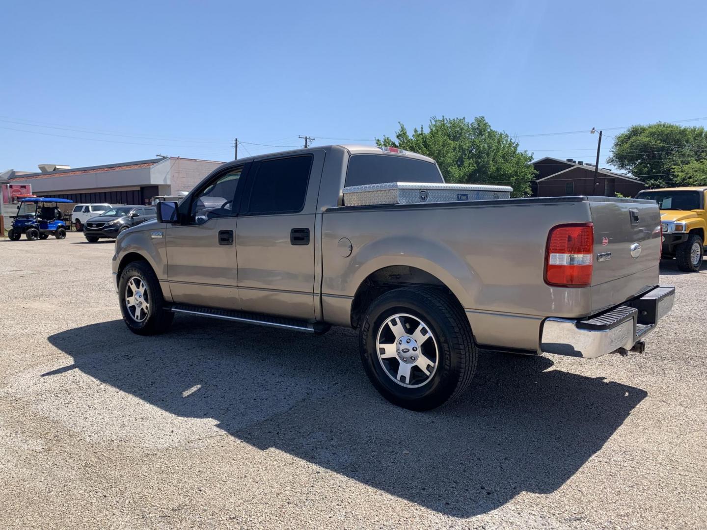 2006 Gold /Tan Ford F-150 Lariat SuperCrew 2WD (1FTPW12516K) with an 5.4L V6 SOHC 16V engine, Automatic transmission, located at 1830 North Belt Line Road, Irving, TX, 75061, (469) 524-0199, 32.834373, -96.993584 - Photo#3