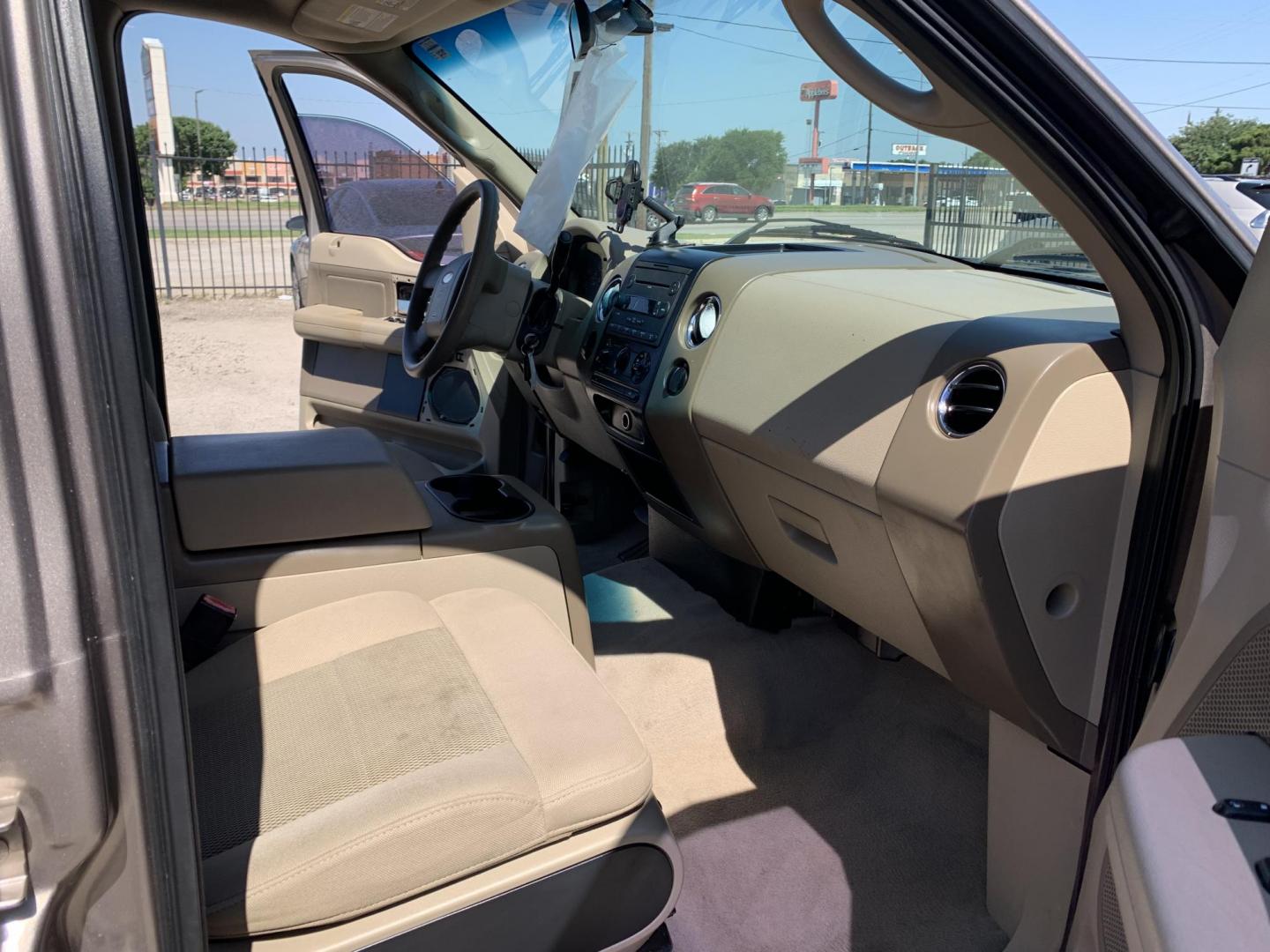 2006 Gold /Tan Ford F-150 Lariat SuperCrew 2WD (1FTPW12516K) with an 5.4L V6 SOHC 16V engine, Automatic transmission, located at 1830 North Belt Line Road, Irving, TX, 75061, (469) 524-0199, 32.834373, -96.993584 - Photo#8