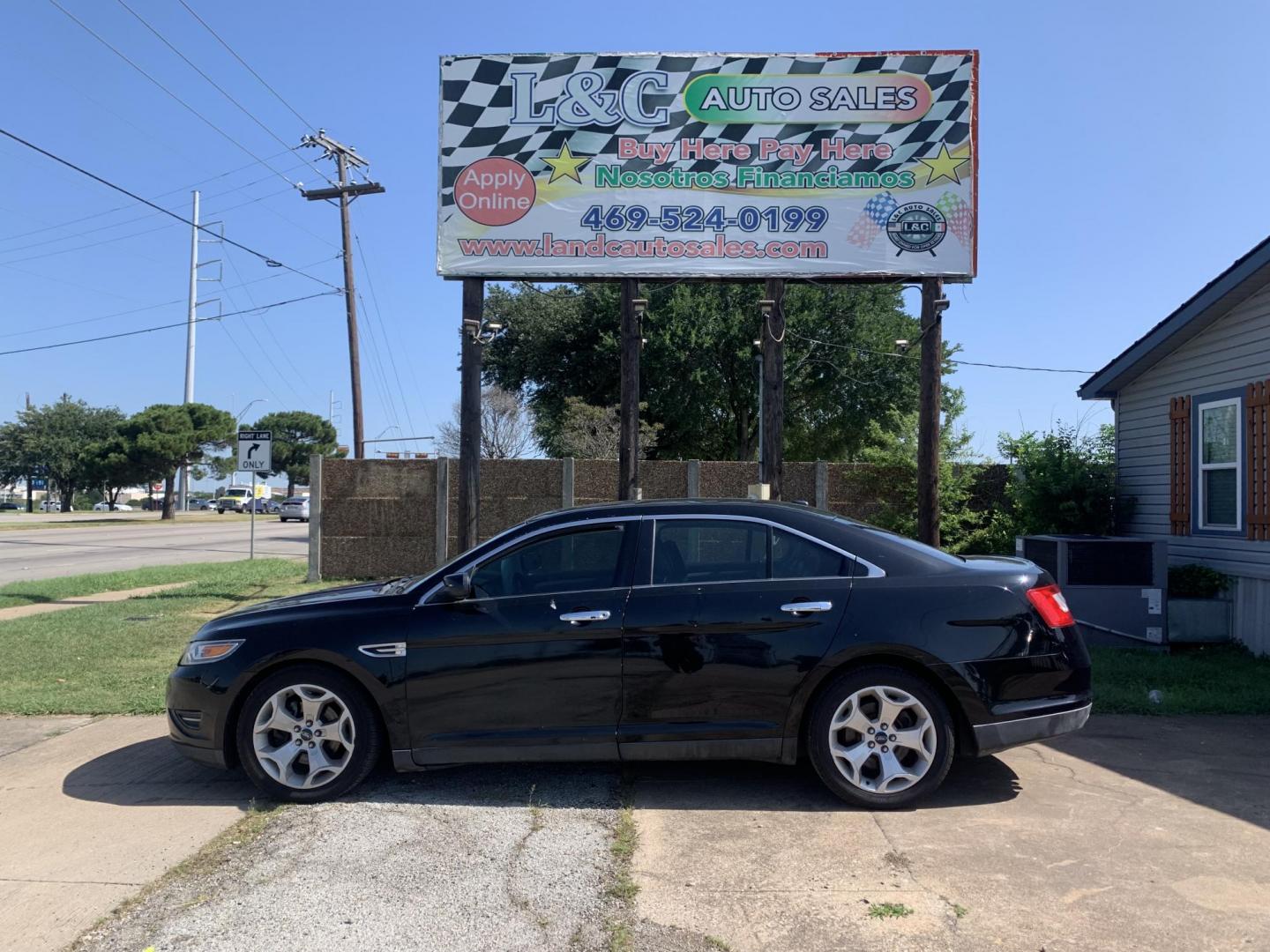 2012 Black Ford Taurus SEL FWD (1FAHP2EW7CG) with an 3.5L V6 DOHC 24V engine, Automatic transmission, located at 1830 North Belt Line Road, Irving, TX, 75061, (469) 524-0199, 32.834373, -96.993584 - Photo#0