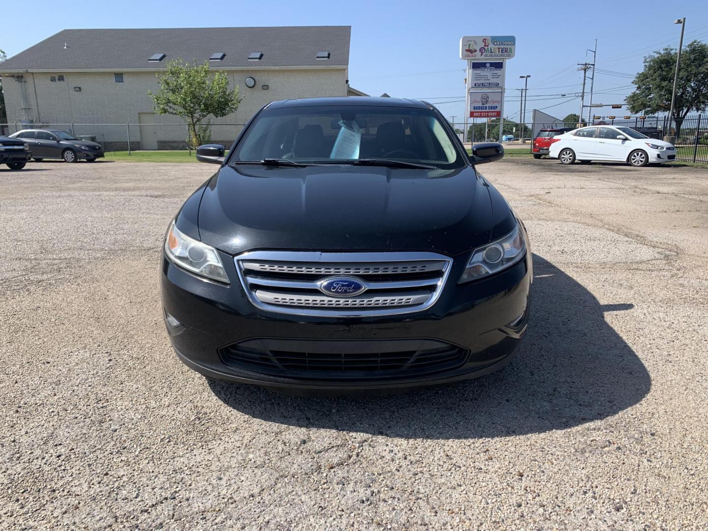2012 Black Ford Taurus SEL FWD (1FAHP2EW7CG) with an 3.5L V6 DOHC 24V engine, Automatic transmission, located at 1830 North Belt Line Road, Irving, TX, 75061, (469) 524-0199, 32.834373, -96.993584 - Photo#1