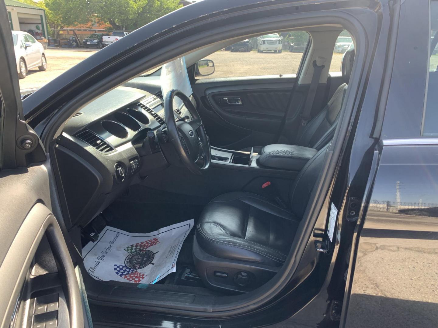 2012 Black Ford Taurus SEL FWD (1FAHP2EW7CG) with an 3.5L V6 DOHC 24V engine, Automatic transmission, located at 1830 North Belt Line Road, Irving, TX, 75061, (469) 524-0199, 32.834373, -96.993584 - Photo#5