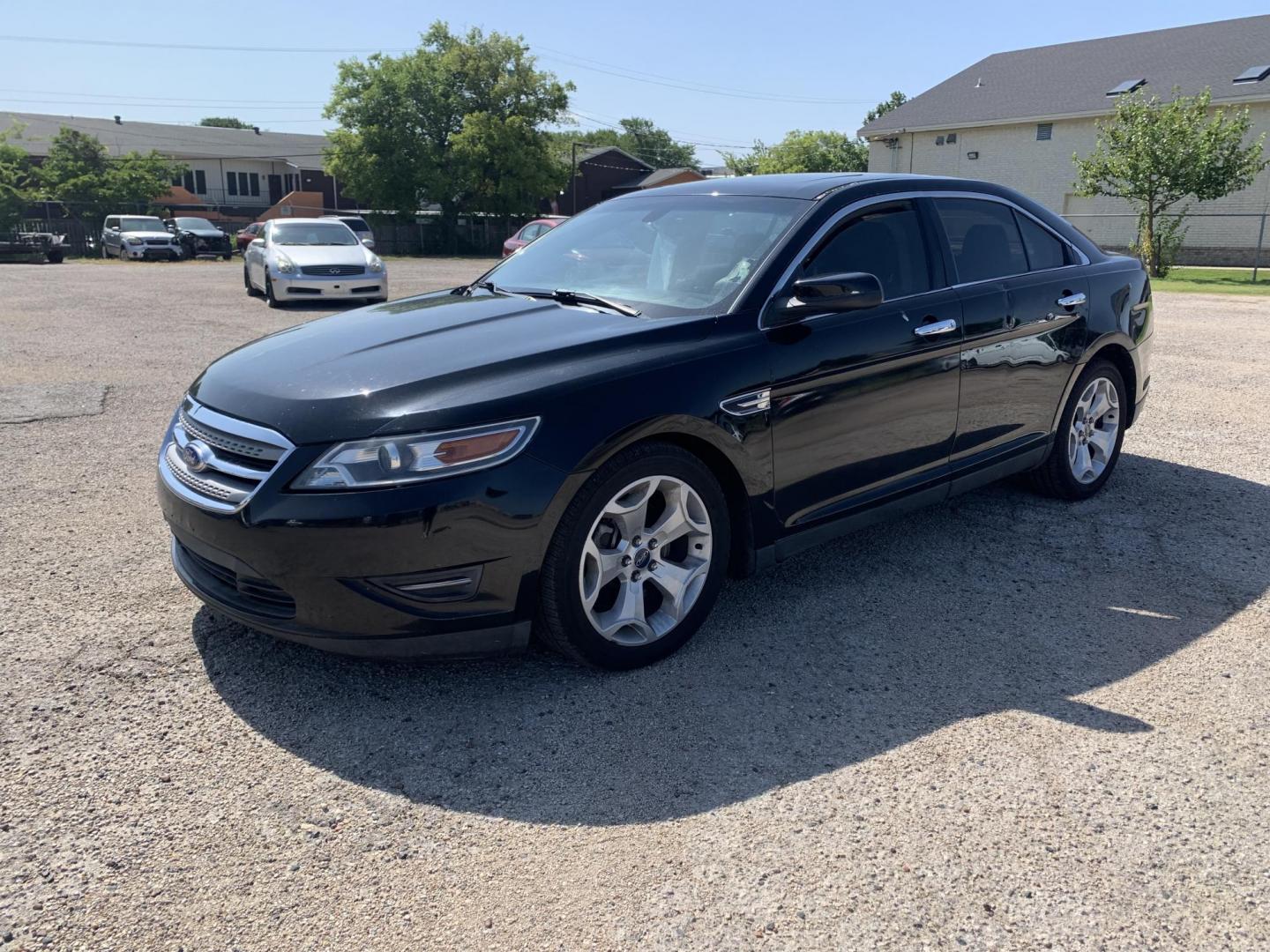 2012 Black Ford Taurus SEL FWD (1FAHP2EW7CG) with an 3.5L V6 DOHC 24V engine, Automatic transmission, located at 1830 North Belt Line Road, Irving, TX, 75061, (469) 524-0199, 32.834373, -96.993584 - Photo#4