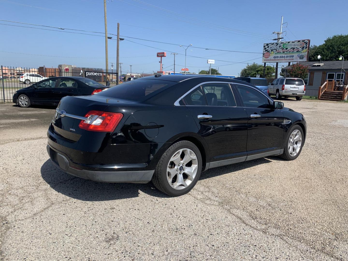 2012 Black Ford Taurus SEL FWD (1FAHP2EW7CG) with an 3.5L V6 DOHC 24V engine, Automatic transmission, located at 1830 North Belt Line Road, Irving, TX, 75061, (469) 524-0199, 32.834373, -96.993584 - Photo#7