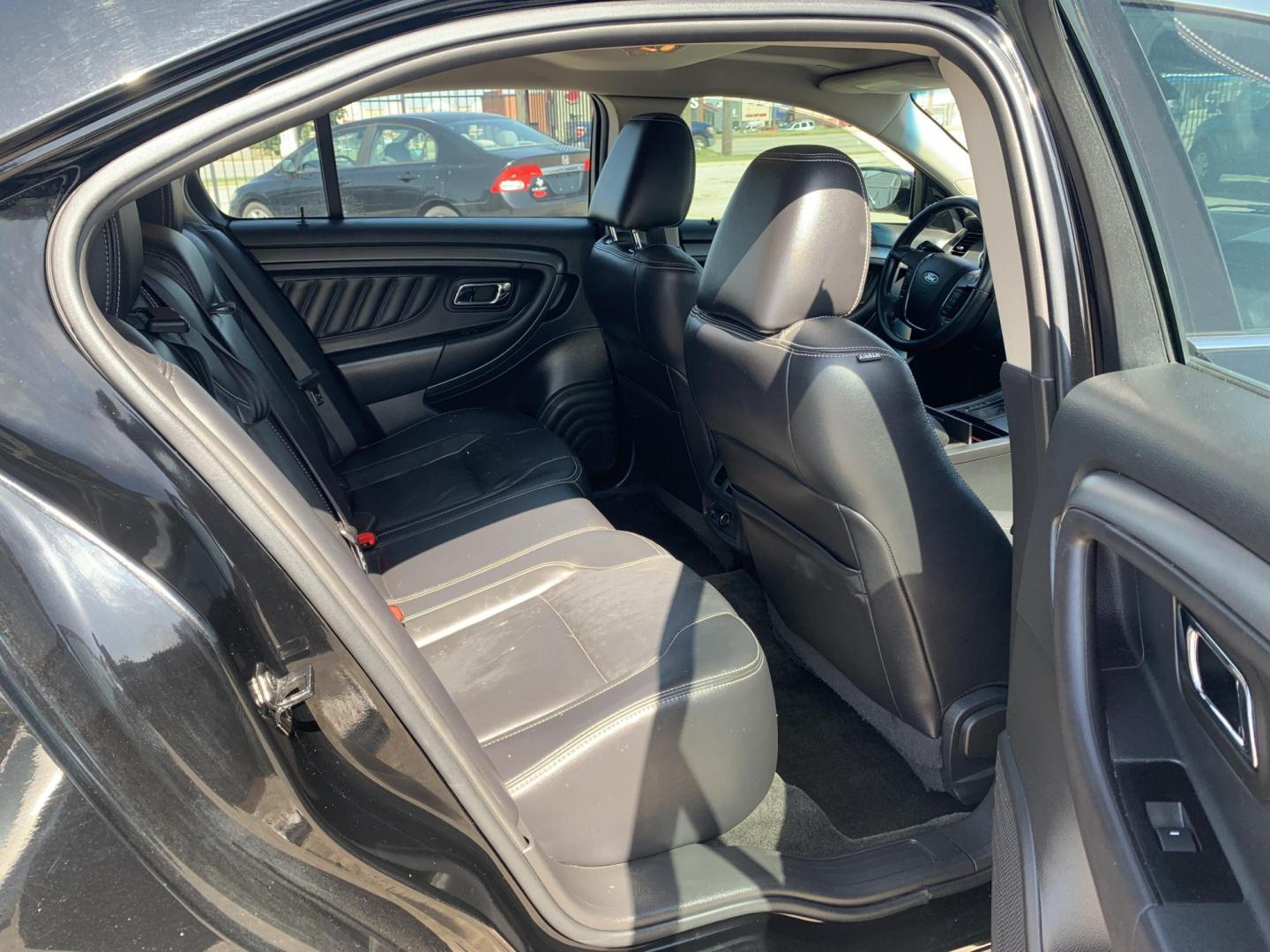 2012 Black Ford Taurus SEL FWD (1FAHP2EW7CG) with an 3.5L V6 DOHC 24V engine, Automatic transmission, located at 1830 North Belt Line Road, Irving, TX, 75061, (469) 524-0199, 32.834373, -96.993584 - Photo#9