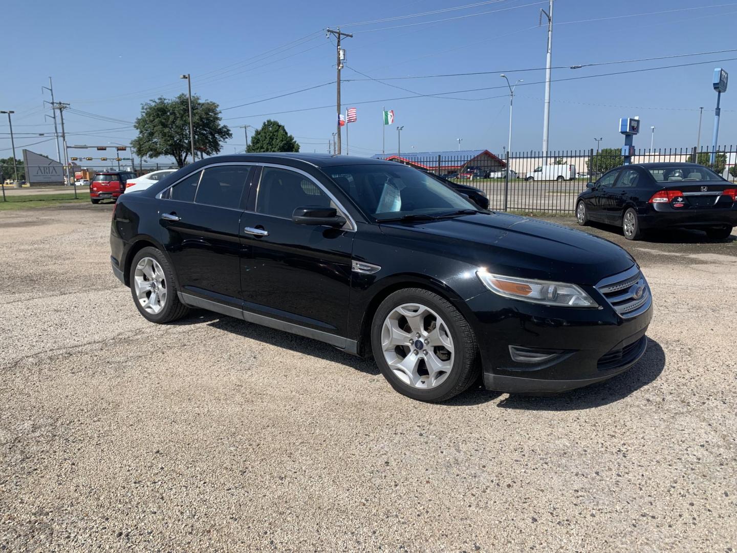 2012 Black Ford Taurus SEL FWD (1FAHP2EW7CG) with an 3.5L V6 DOHC 24V engine, Automatic transmission, located at 1830 North Belt Line Road, Irving, TX, 75061, (469) 524-0199, 32.834373, -96.993584 - Photo#6