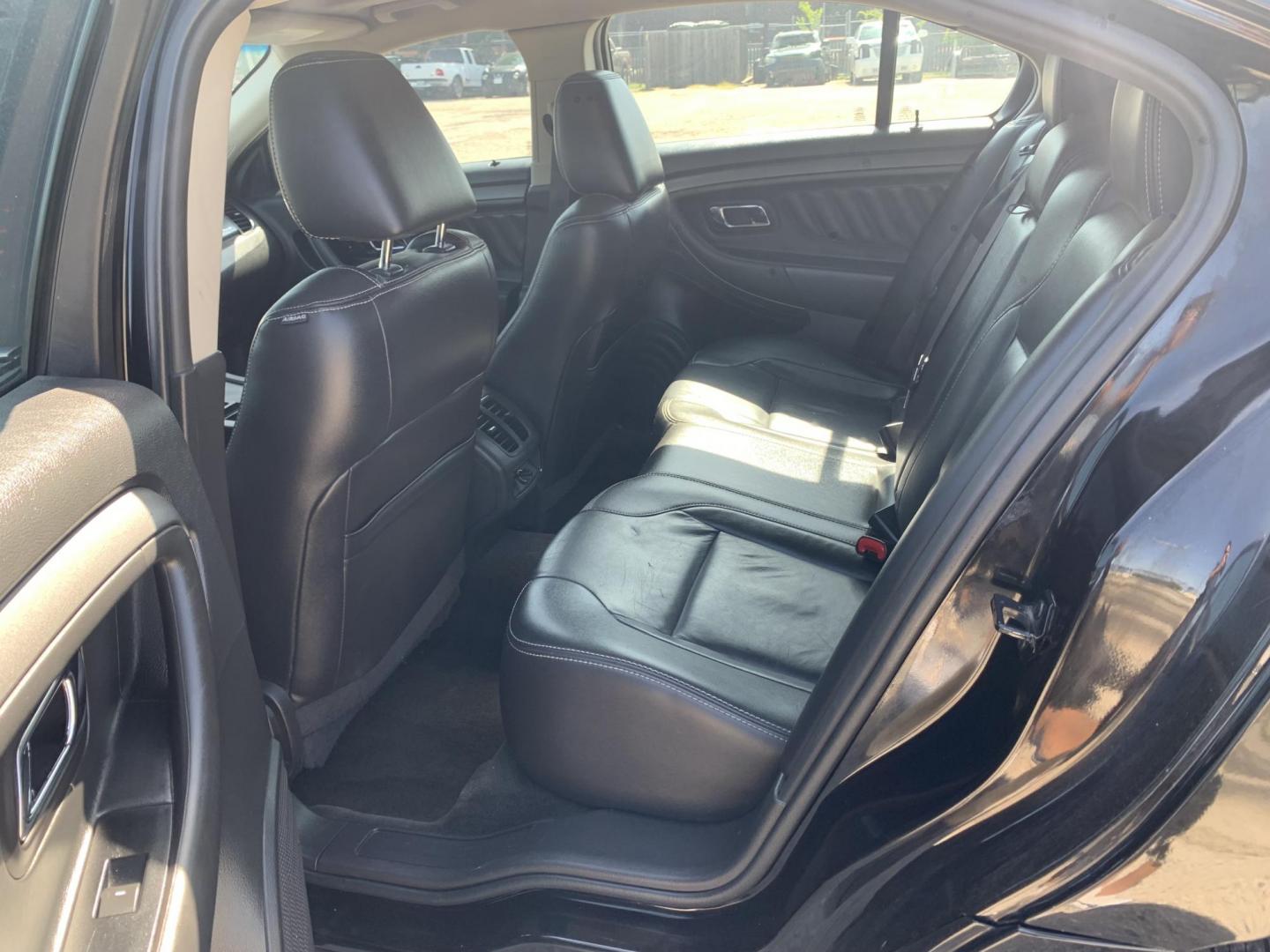 2012 Black Ford Taurus SEL FWD (1FAHP2EW7CG) with an 3.5L V6 DOHC 24V engine, Automatic transmission, located at 1830 North Belt Line Road, Irving, TX, 75061, (469) 524-0199, 32.834373, -96.993584 - Photo#10