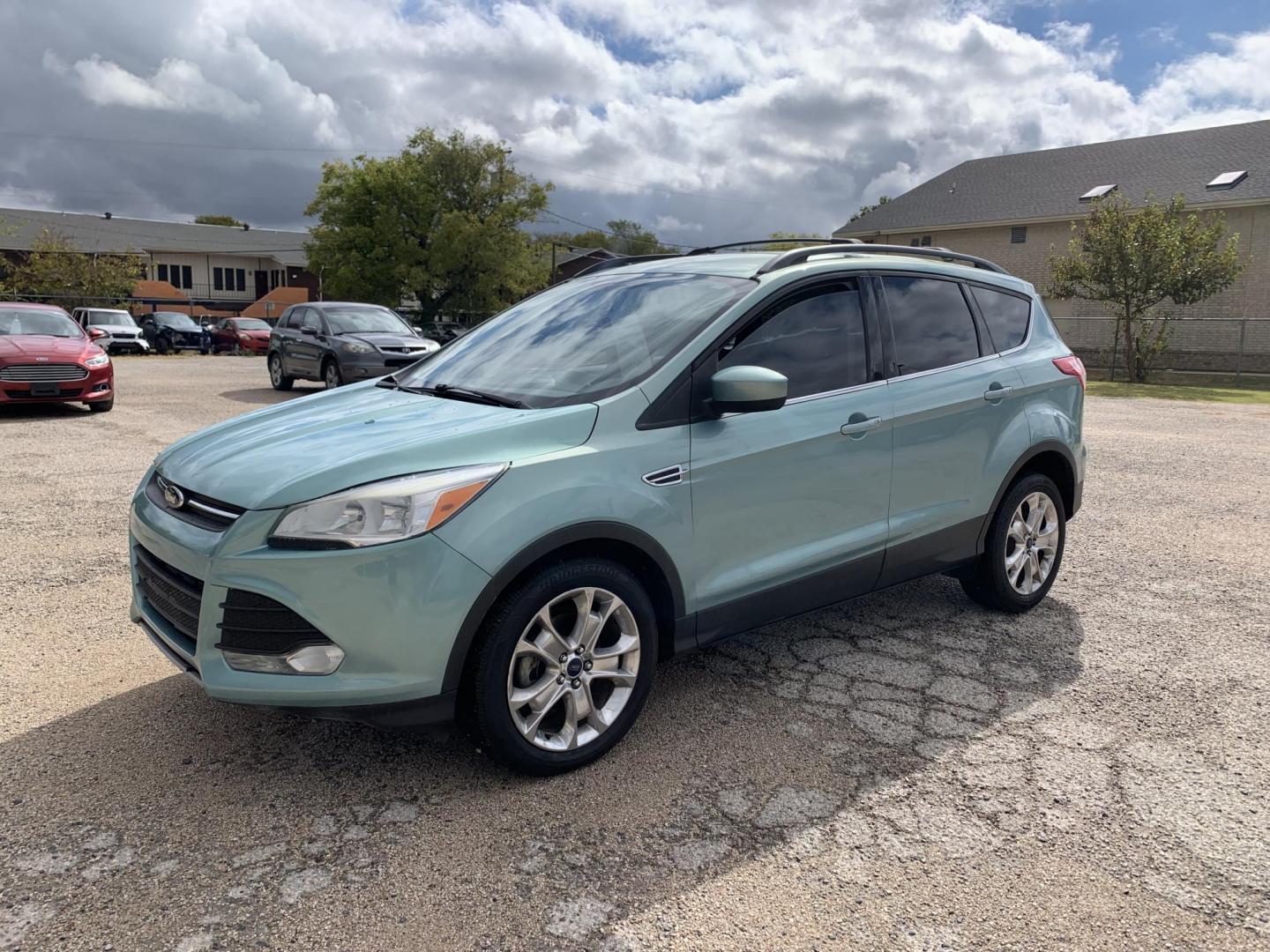 2013 Blue /Tan Ford Escape SE FWD (1FMCU0GX9DU) with an 1.6L L4 DOHC 16V engine, Automatic transmission, located at 1830 North Belt Line Road, Irving, TX, 75061, (469) 524-0199, 32.834373, -96.993584 - Photo#2