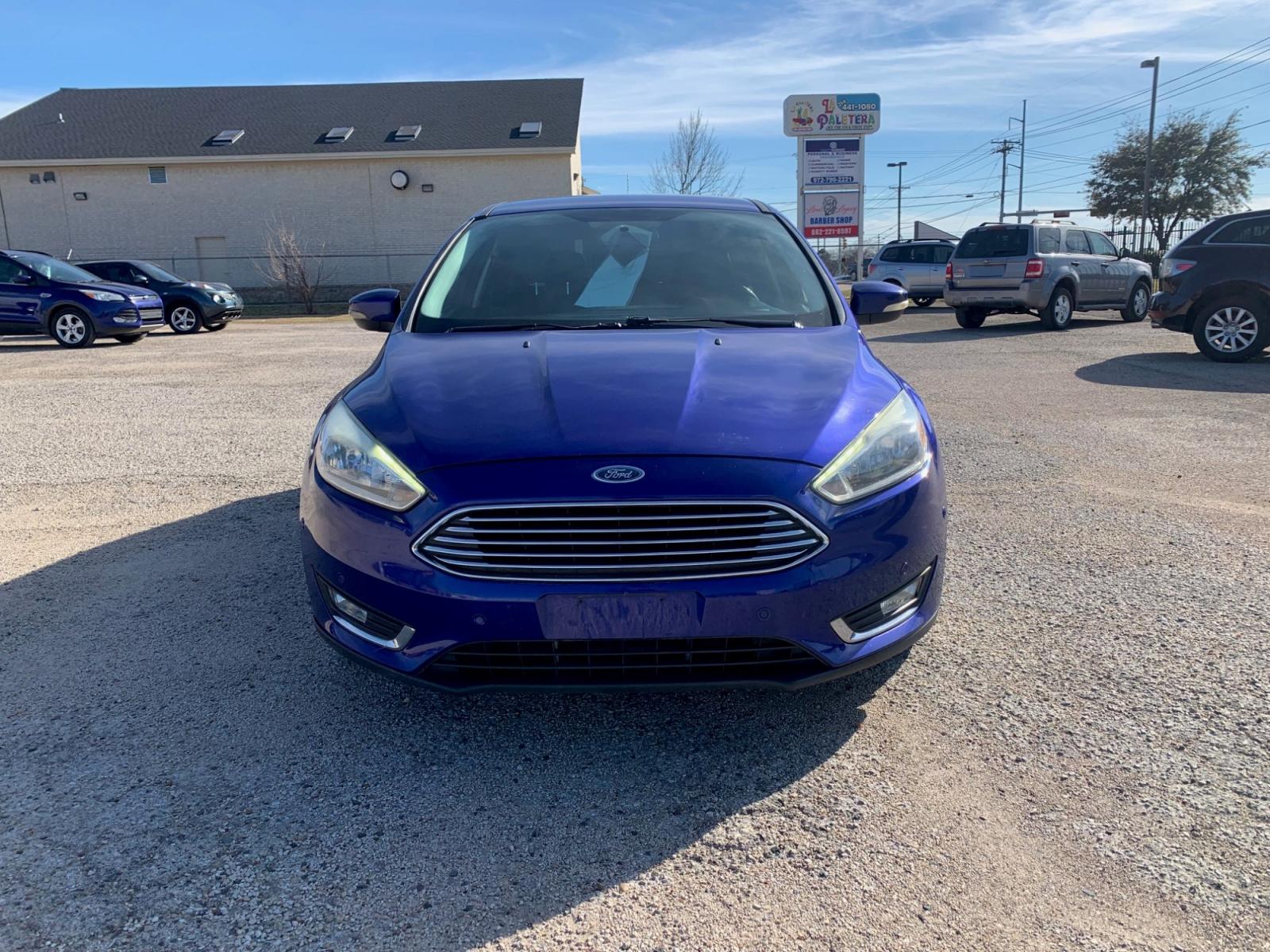 2015 Blue /Black Ford Focus Titanium Hatch (1FADP3N21FL) with an 2.0L L4 DOHC 16V engine, Automatic transmission, located at 1830 North Belt Line Road, Irving, TX, 75061, (469) 524-0199, 32.834373, -96.993584 - Photo #1