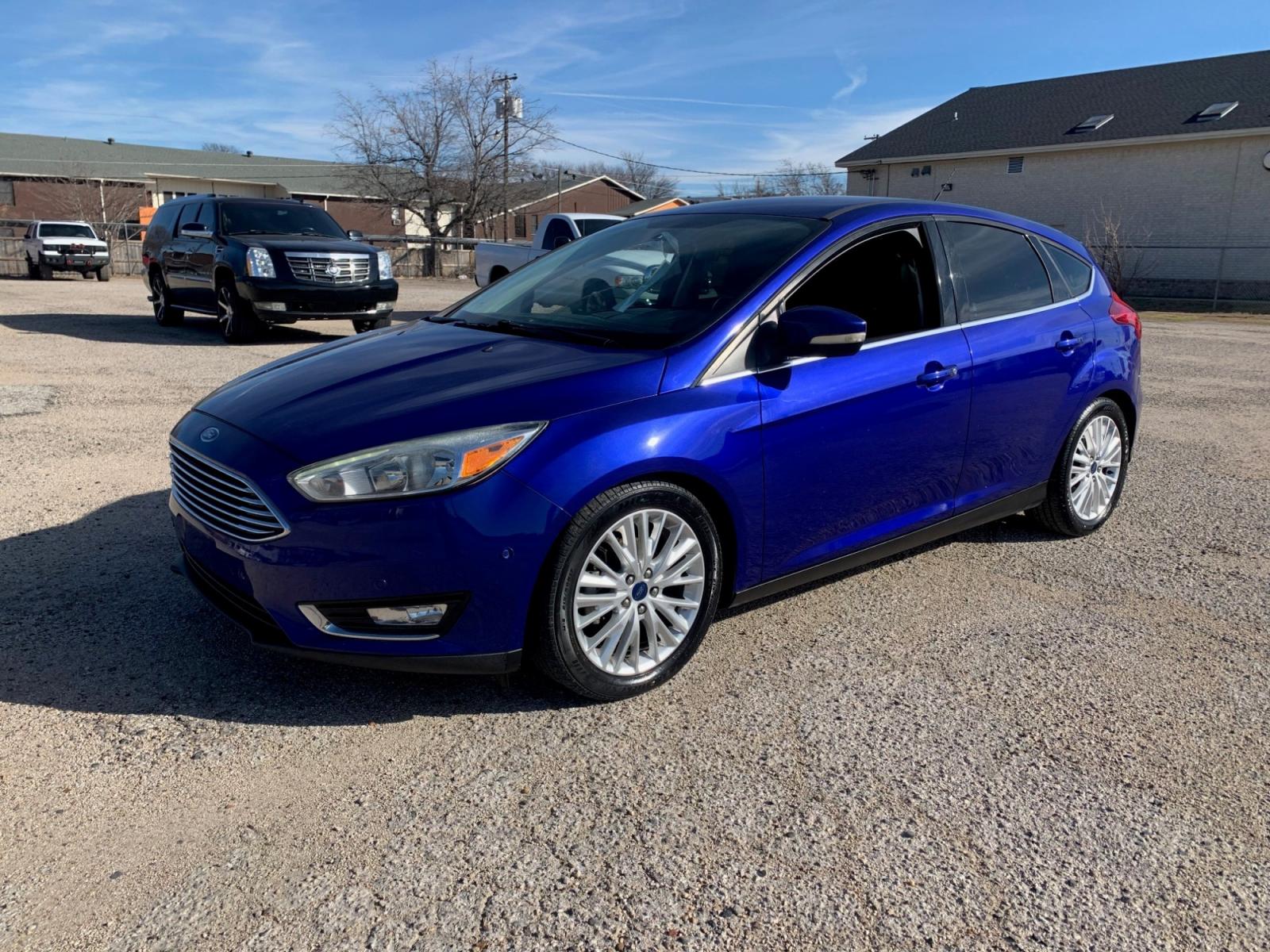 2015 Blue /Black Ford Focus Titanium Hatch (1FADP3N21FL) with an 2.0L L4 DOHC 16V engine, Automatic transmission, located at 1830 North Belt Line Road, Irving, TX, 75061, (469) 524-0199, 32.834373, -96.993584 - Photo #2