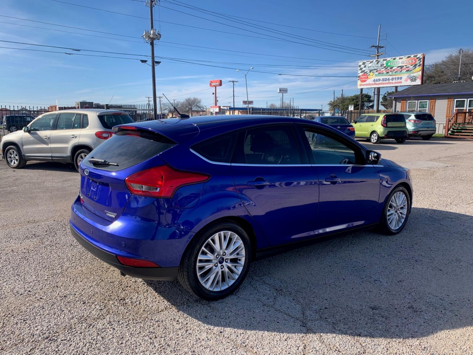 2015 Blue /Black Ford Focus Titanium Hatch (1FADP3N21FL) with an 2.0L L4 DOHC 16V engine, Automatic transmission, located at 1830 North Belt Line Road, Irving, TX, 75061, (469) 524-0199, 32.834373, -96.993584 - Photo #5