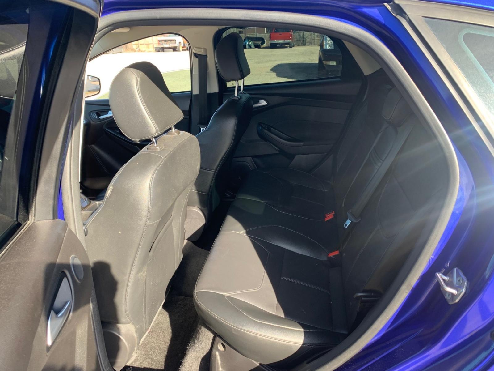 2015 Blue /Black Ford Focus Titanium Hatch (1FADP3N21FL) with an 2.0L L4 DOHC 16V engine, Automatic transmission, located at 1830 North Belt Line Road, Irving, TX, 75061, (469) 524-0199, 32.834373, -96.993584 - Photo #8