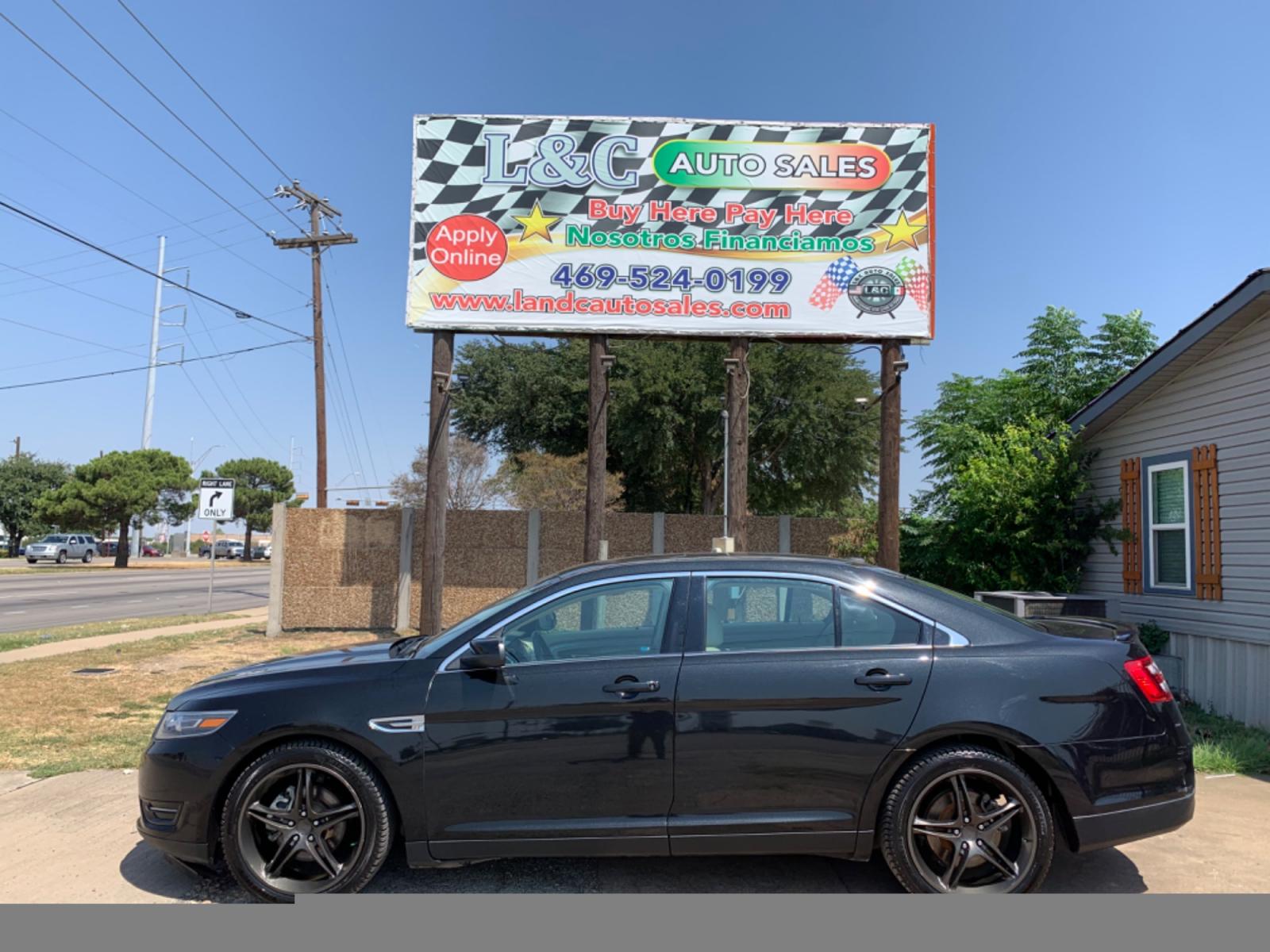 2014 Black /Tan Ford Taurus SEL FWD (1FAHP2E88EG) with an 3.5L V6 DOHC 24V engine, Automatic transmission, located at 1830 North Belt Line Road, Irving, TX, 75061, (469) 524-0199, 32.834373, -96.993584 - Photo #0