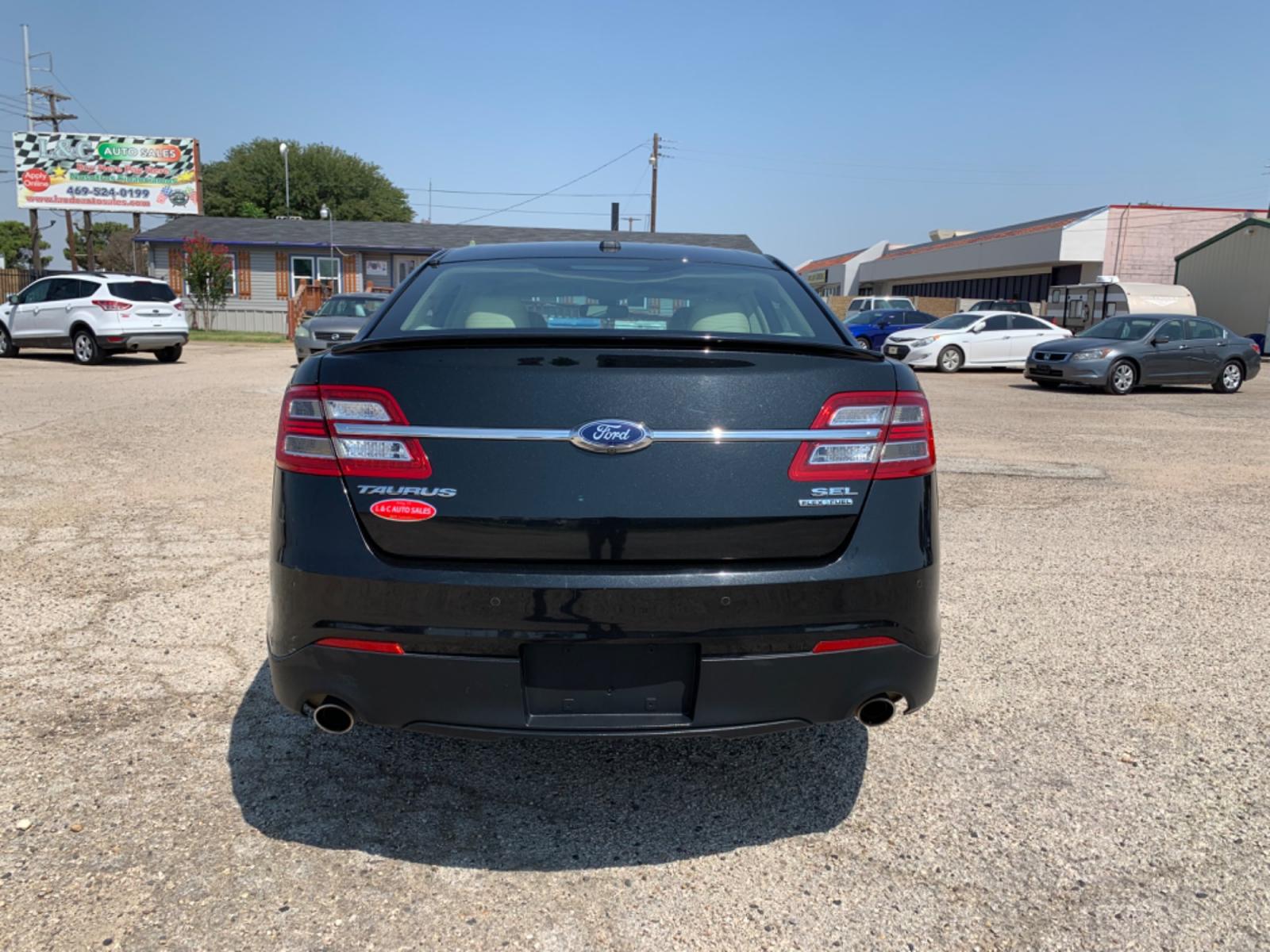 2014 Black /Tan Ford Taurus SEL FWD (1FAHP2E88EG) with an 3.5L V6 DOHC 24V engine, Automatic transmission, located at 1830 North Belt Line Road, Irving, TX, 75061, (469) 524-0199, 32.834373, -96.993584 - Photo #2