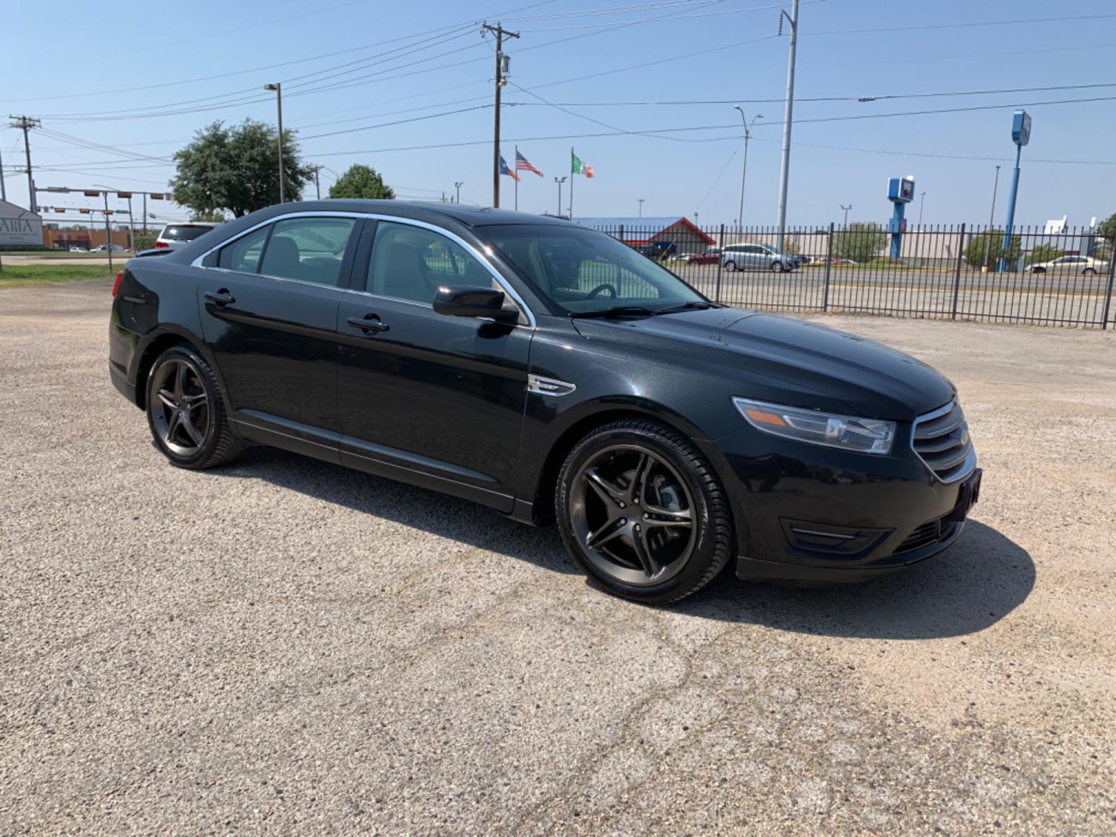 2014 Black /Tan Ford Taurus SEL FWD (1FAHP2E88EG) with an 3.5L V6 DOHC 24V engine, Automatic transmission, located at 1830 North Belt Line Road, Irving, TX, 75061, (469) 524-0199, 32.834373, -96.993584 - Photo #6