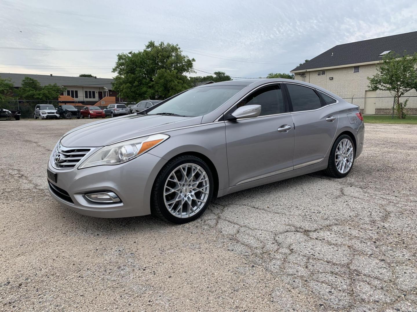 2012 Silver /Tan Hyundai Azera 3.3L (KMHFH4JG9CA) with an 3.3L V6 DOHC 24V engine, Automatic transmission, located at 1830 North Belt Line Road, Irving, TX, 75061, (469) 524-0199, 32.834373, -96.993584 - Photo#4