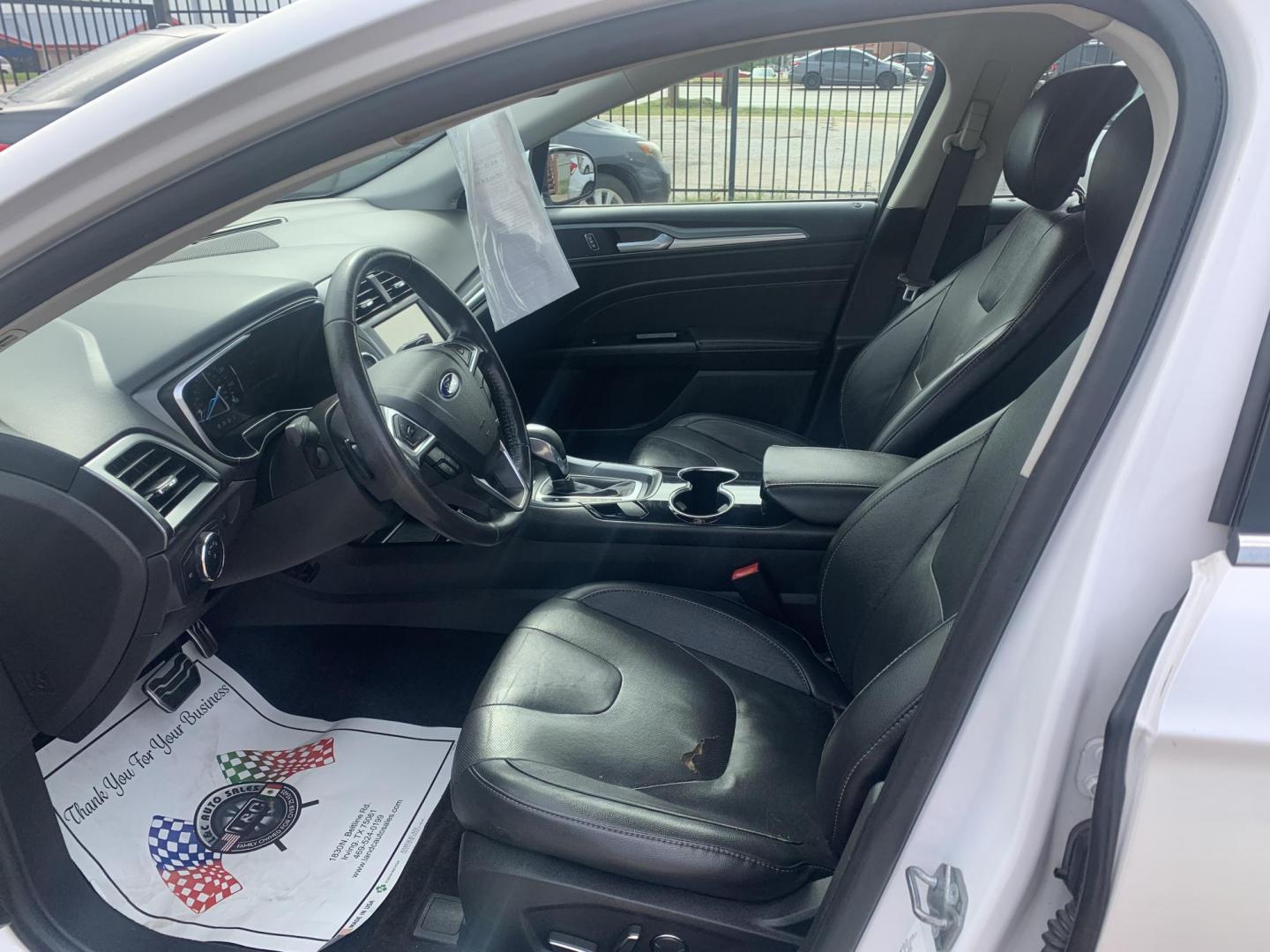 2015 White /Black Ford Fusion Titanium (3FA6P0K99FR) with an 2.0L L4 DOHC 16V engine, AUTOMATIC transmission, located at 1830 North Belt Line Road, Irving, TX, 75061, (469) 524-0199, 32.834373, -96.993584 - Photo#2