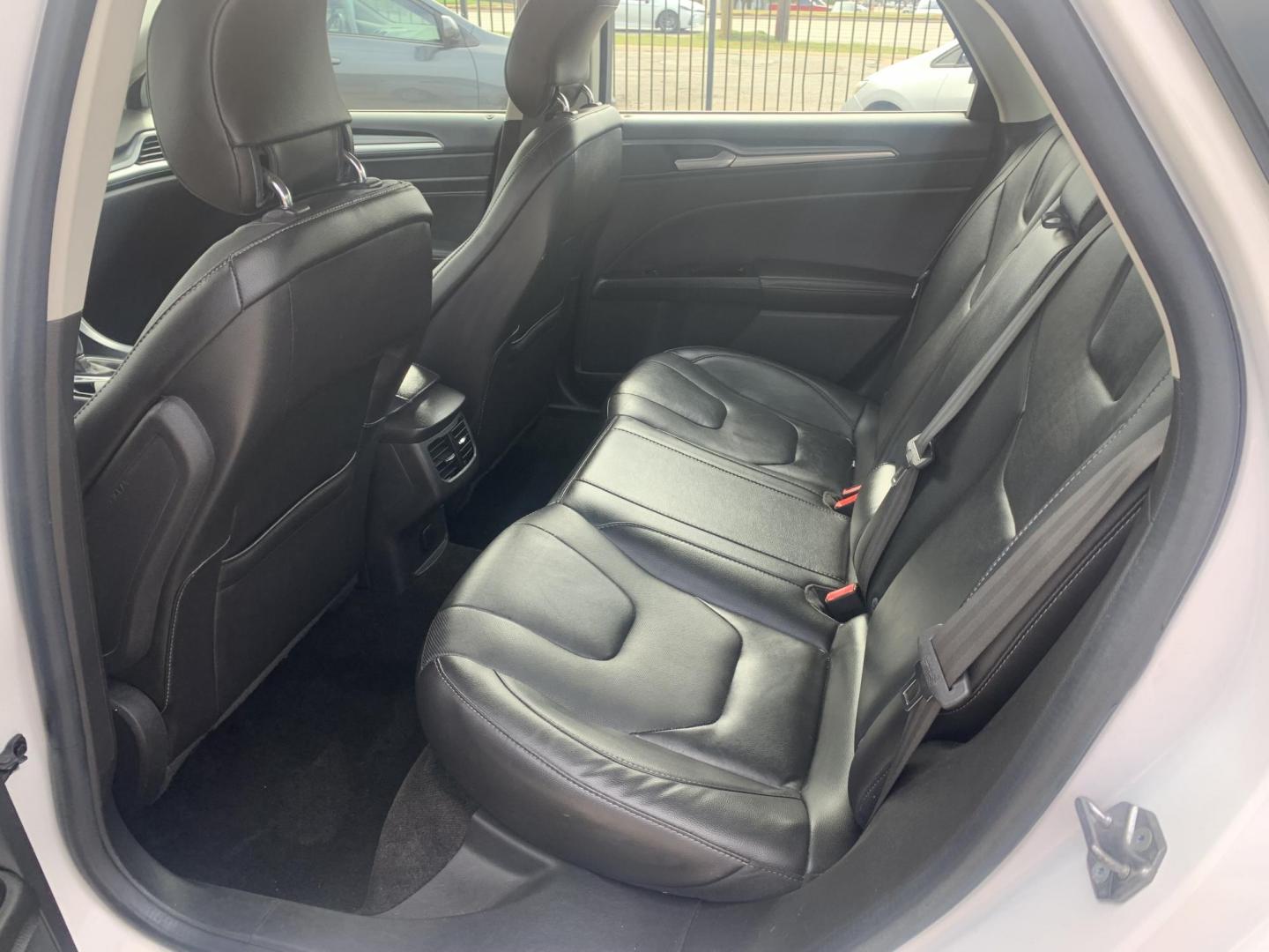 2015 White /Black Ford Fusion Titanium (3FA6P0K99FR) with an 2.0L L4 DOHC 16V engine, AUTOMATIC transmission, located at 1830 North Belt Line Road, Irving, TX, 75061, (469) 524-0199, 32.834373, -96.993584 - Photo#3