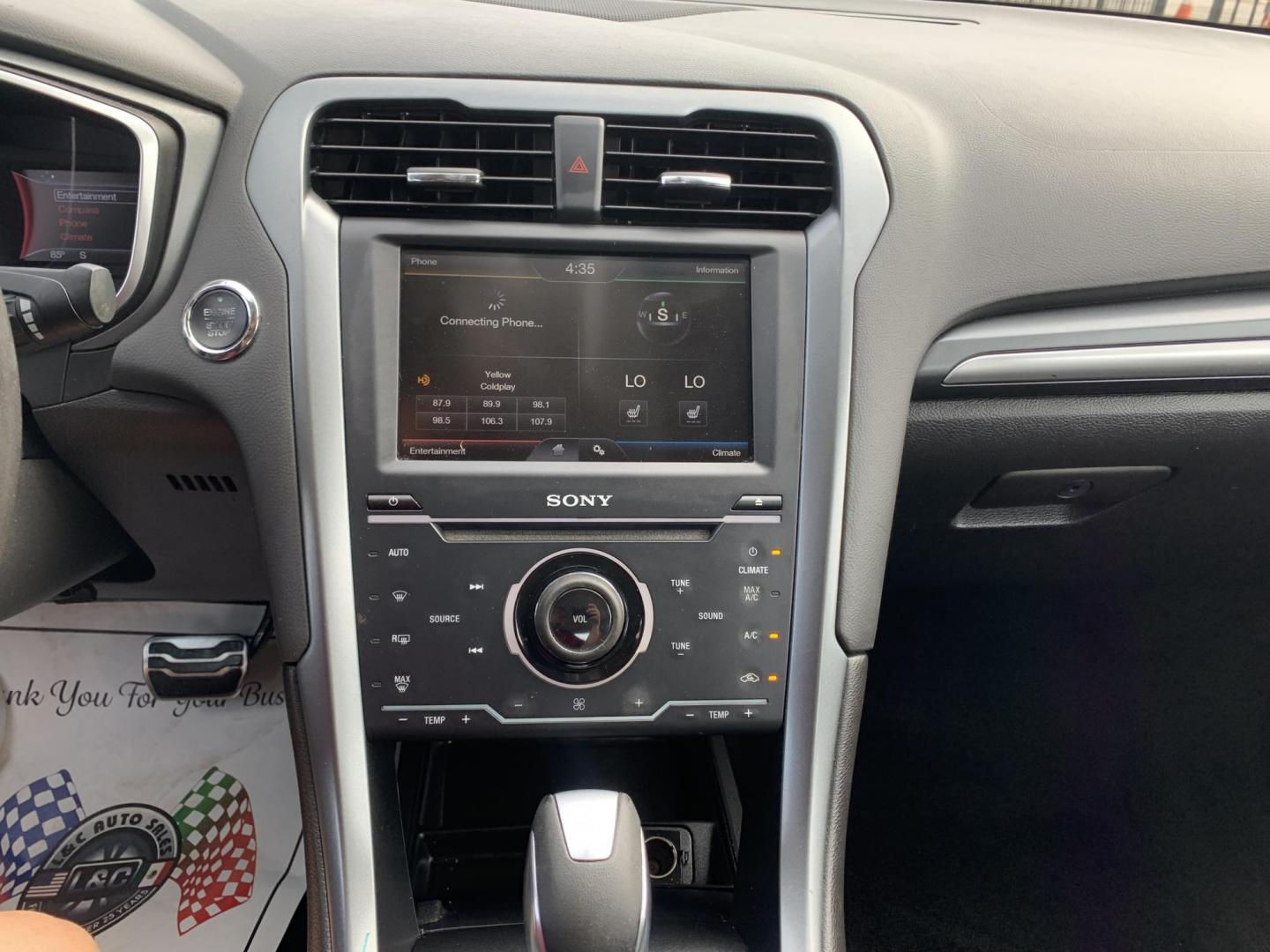 2015 White /Black Ford Fusion Titanium (3FA6P0K99FR) with an 2.0L L4 DOHC 16V engine, AUTOMATIC transmission, located at 1830 North Belt Line Road, Irving, TX, 75061, (469) 524-0199, 32.834373, -96.993584 - Photo#6