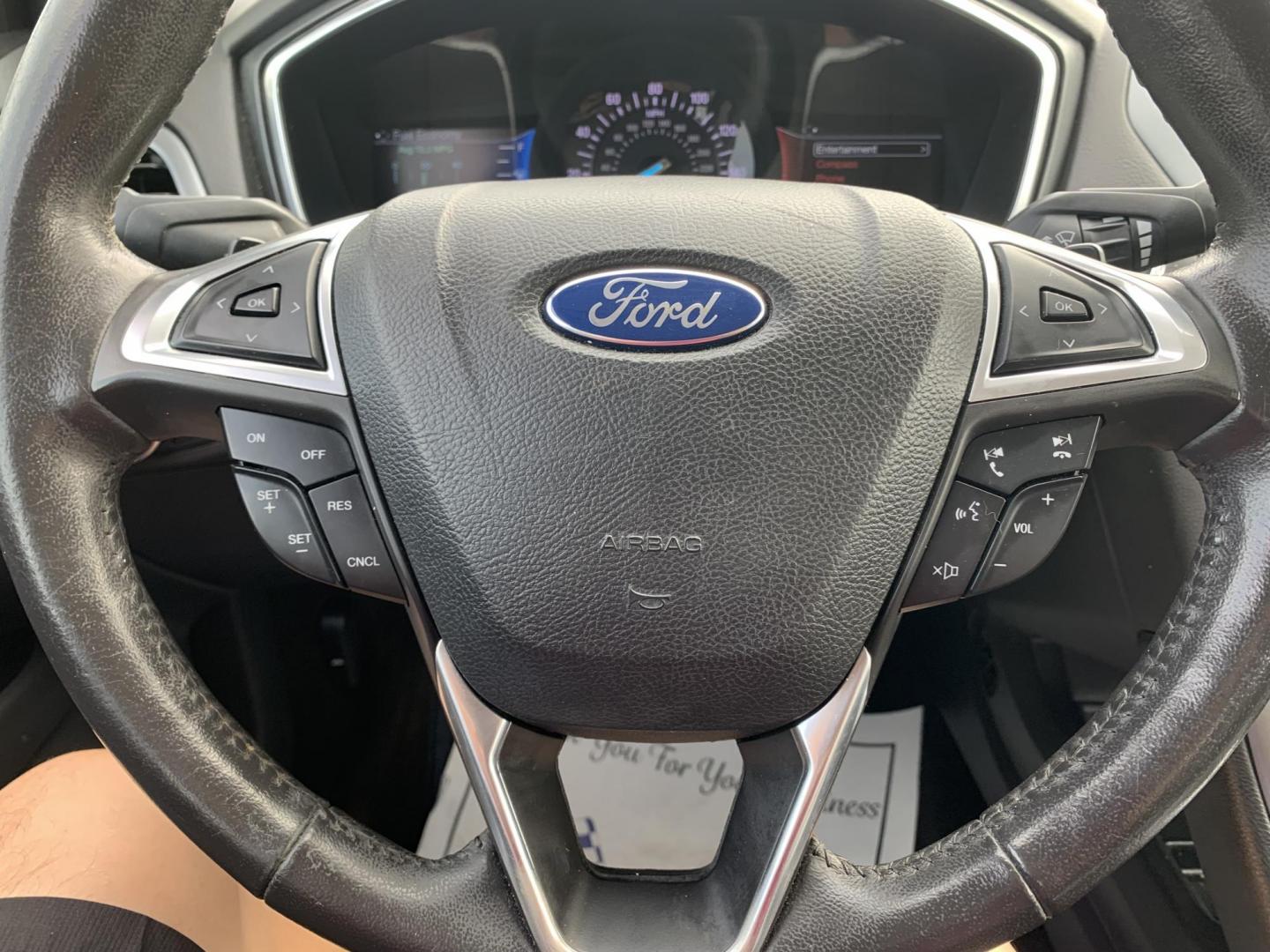 2015 White /Black Ford Fusion Titanium (3FA6P0K99FR) with an 2.0L L4 DOHC 16V engine, AUTOMATIC transmission, located at 1830 North Belt Line Road, Irving, TX, 75061, (469) 524-0199, 32.834373, -96.993584 - Photo#8
