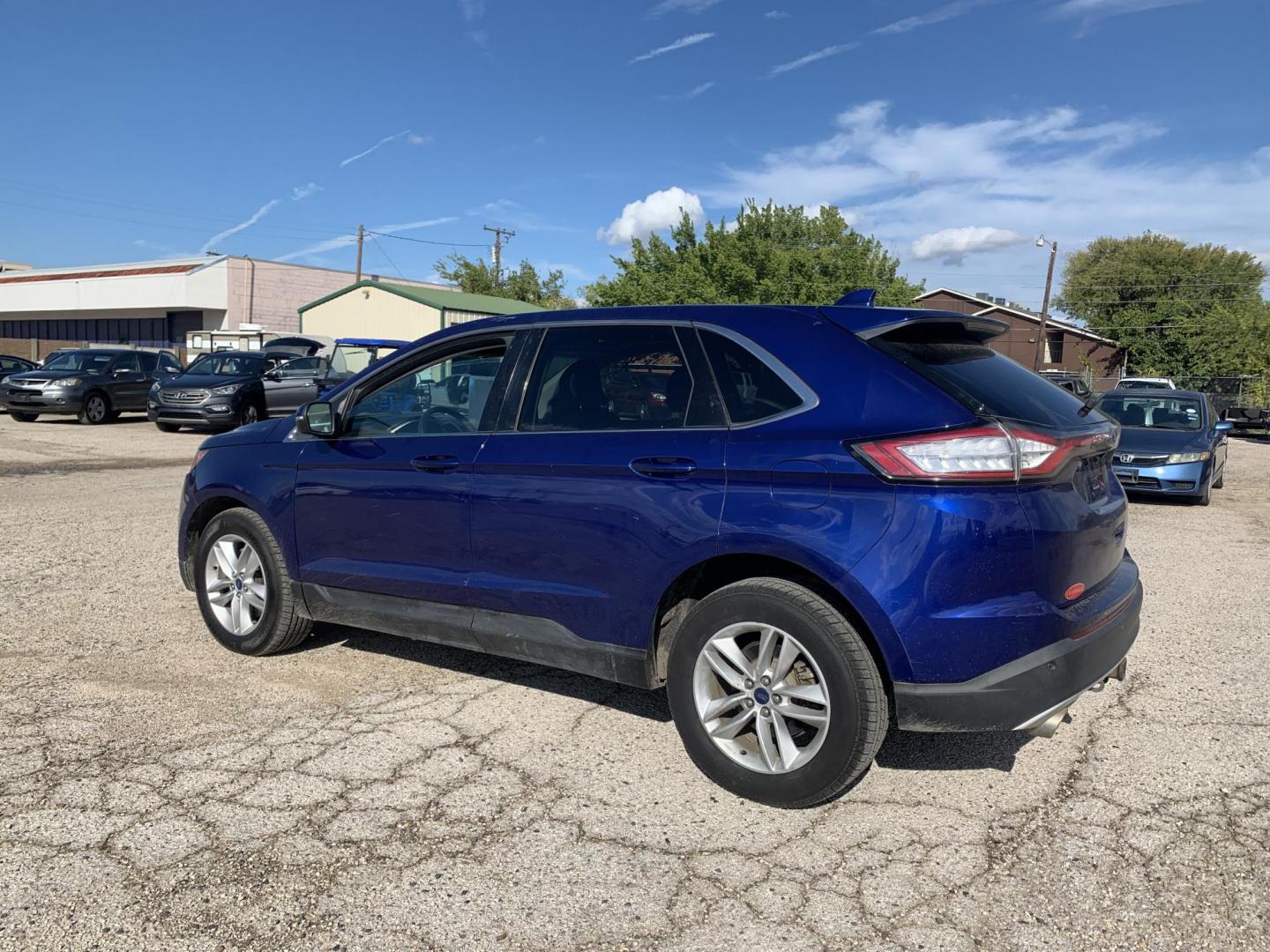 2015 Blue /Black Ford Edge SEL AWD (2FMTK4J97FB) with an 2.0L L4 DOHC 16V engine, Automatic transmission, located at 1830 North Belt Line Road, Irving, TX, 75061, (469) 524-0199, 32.834373, -96.993584 - Photo#3