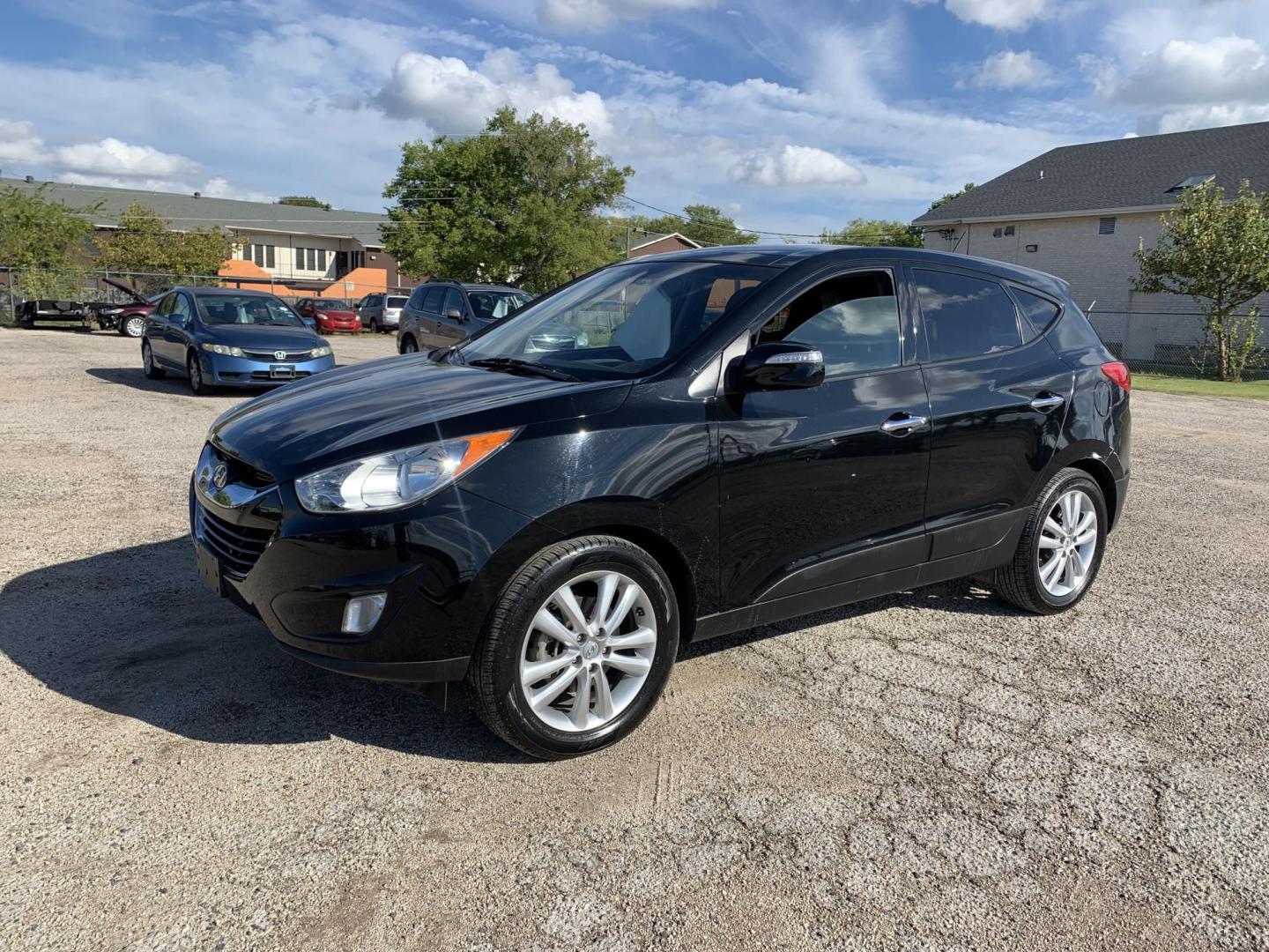 2012 Black /Tan Hyundai Tucson Limited 2WD (KM8JU3AC5CU) with an 2.4L L4 DOHC 16V engine, Automatic transmission, located at 1830 North Belt Line Road, Irving, TX, 75061, (469) 524-0199, 32.834373, -96.993584 - Photo#2