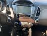 2012 Black /Tan Hyundai Tucson Limited 2WD (KM8JU3AC5CU) with an 2.4L L4 DOHC 16V engine, Automatic transmission, located at 1830 North Belt Line Road, Irving, TX, 75061, (469) 524-0199, 32.834373, -96.993584 - Photo#10