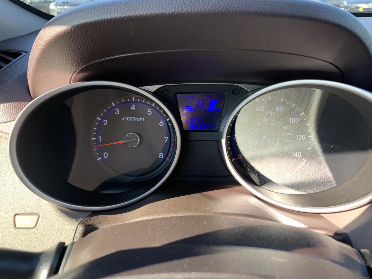 2012 Black /Tan Hyundai Tucson Limited 2WD (KM8JU3AC5CU) with an 2.4L L4 DOHC 16V engine, Automatic transmission, located at 1830 North Belt Line Road, Irving, TX, 75061, (469) 524-0199, 32.834373, -96.993584 - Photo#14