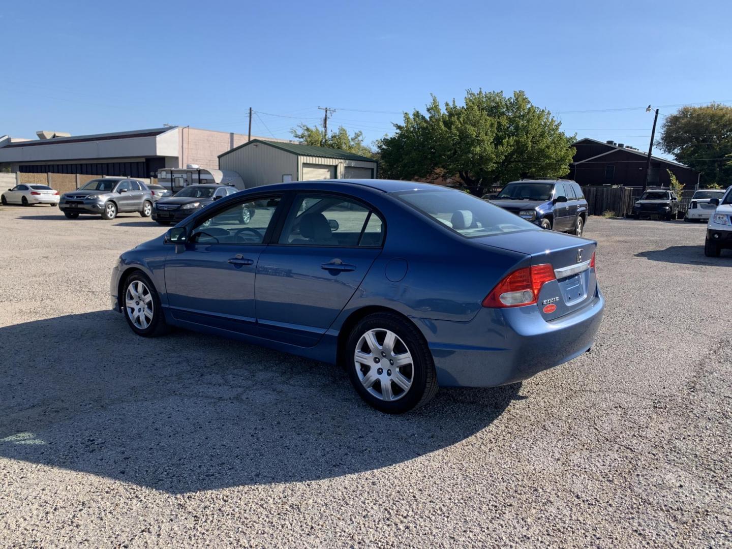 2010 Blue /gray Honda Civic LX Sedan AT (19XFA1F56AE) with an 1.8L L4 SOHC 16V engine, Automatic transmission, located at 1830 North Belt Line Road, Irving, TX, 75061, (469) 524-0199, 32.834373, -96.993584 - Photo#5
