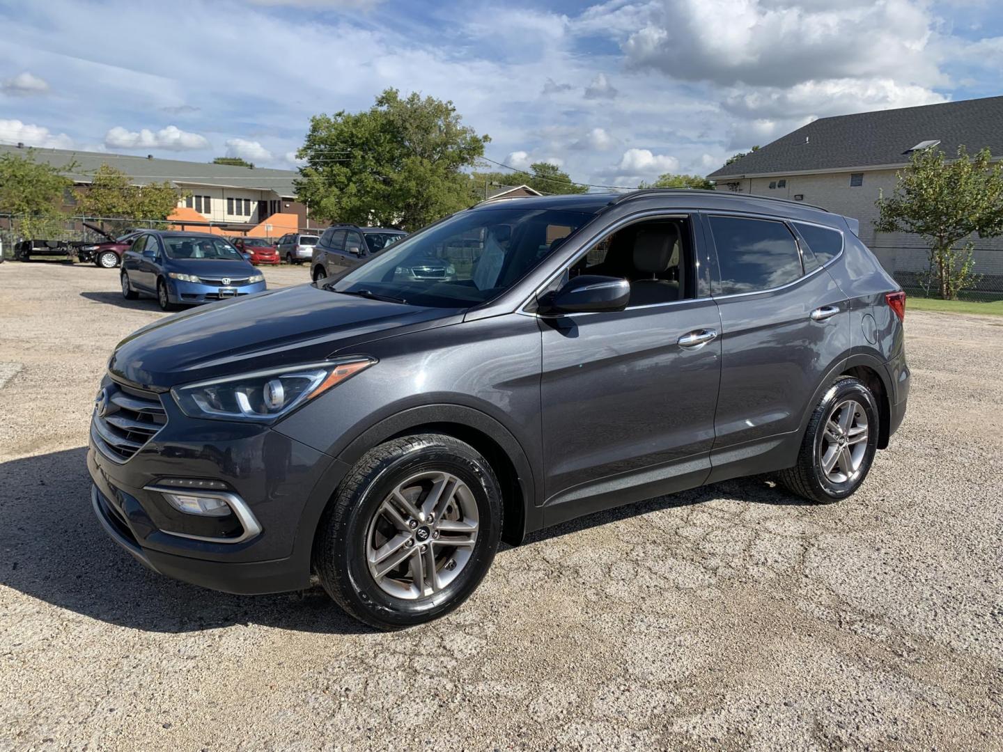 2017 Gray /Black Hyundai Santa Fe Sport 2.4 FWD (5XYZU3LB8HG) with an 2.4L L4 DOHC 16V engine, AUTOMATIC transmission, located at 1830 North Belt Line Road, Irving, TX, 75061, (469) 524-0199, 32.834373, -96.993584 - Photo#2