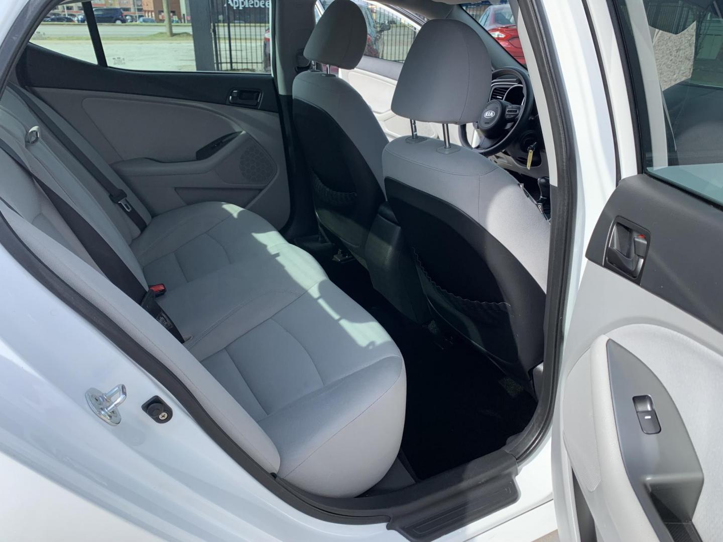 2015 White /Black Kia Optima LX (KNAGM4A7XF5) with an 2.4L L4 DOHC 16V engine, Automatic transmission, located at 1830 North Belt Line Road, Irving, TX, 75061, (469) 524-0199, 32.834373, -96.993584 - Photo#9