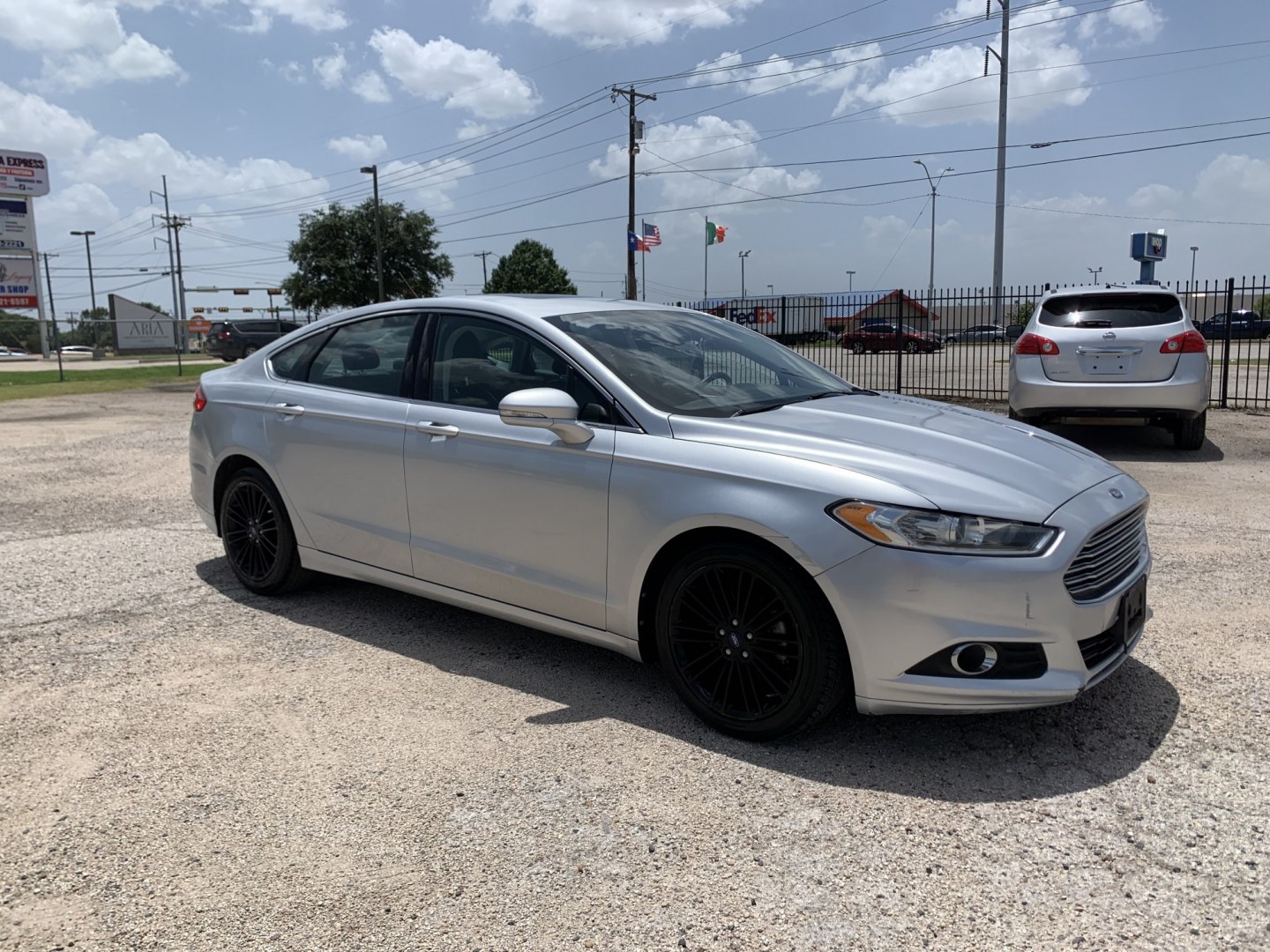 2016 Silver /Black Ford Fusion SE (3FA6P0HD5GR) with an 1.5L L4 DOHC 16V engine, Automatic transmission, located at 1830 North Belt Line Road, Irving, TX, 75061, (469) 524-0199, 32.834373, -96.993584- Photo#6
